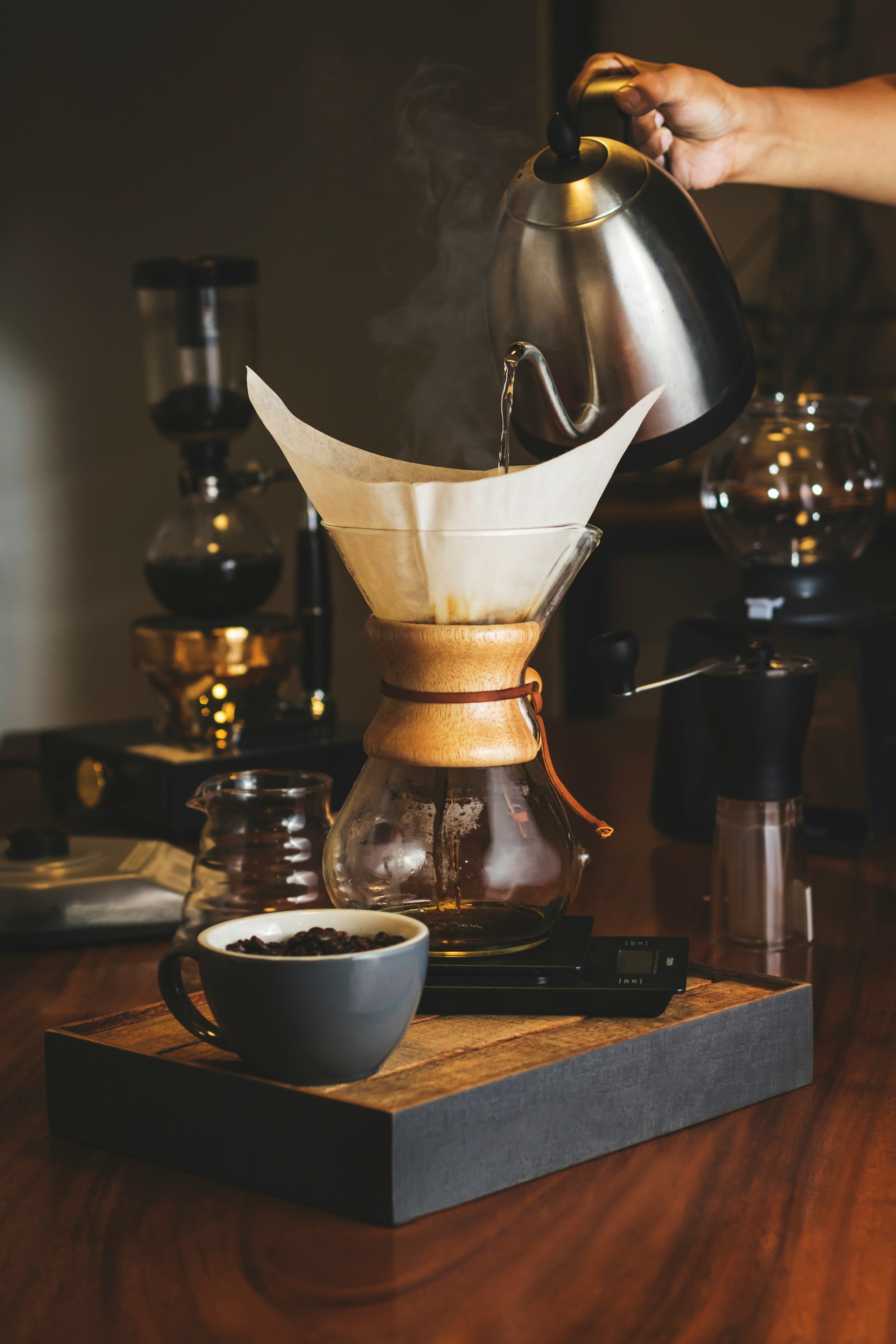 Pour-over coffee filter with dark coffee dripping through, filtering grounds from liquid