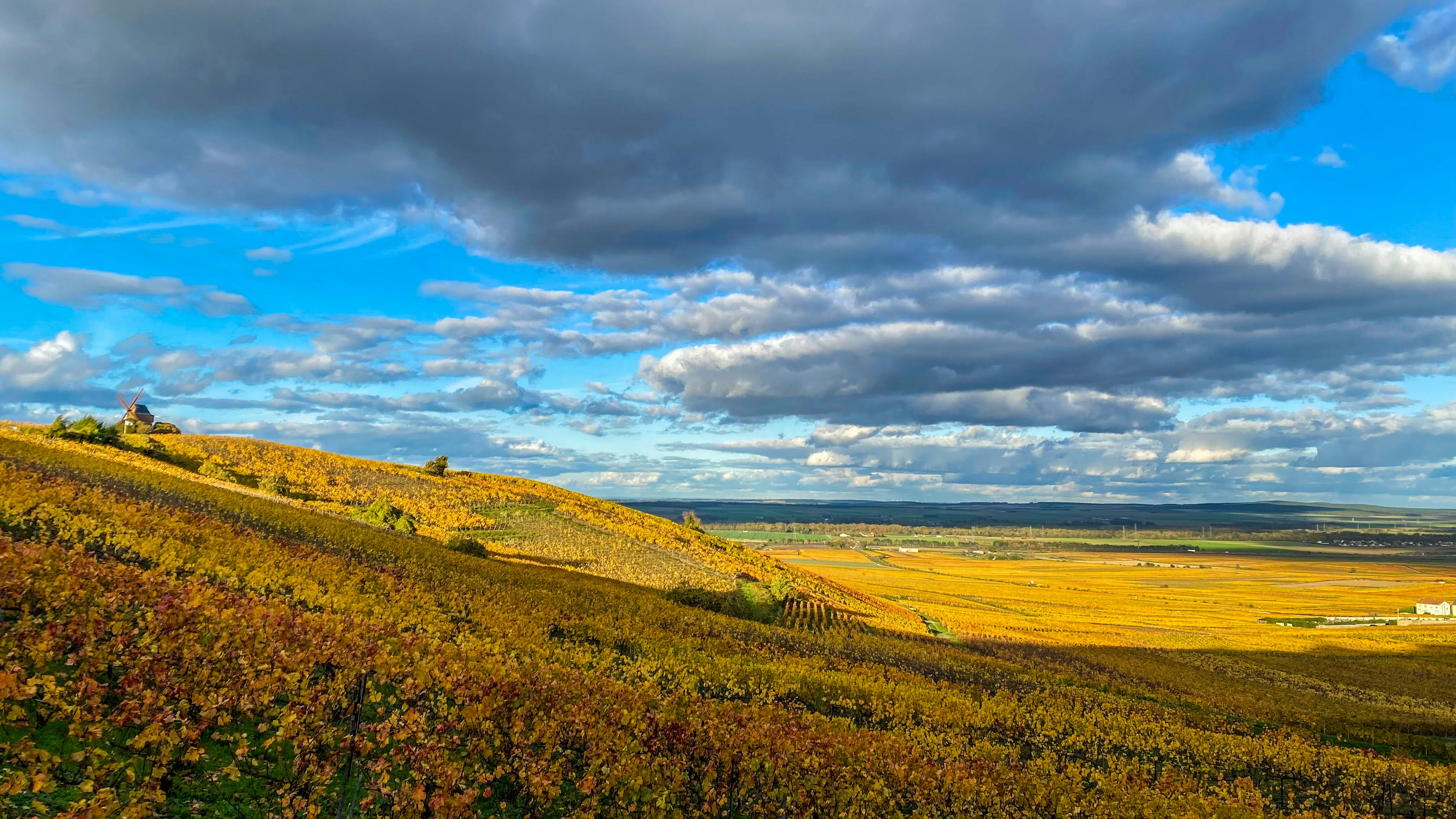 European countryside with dramatic clouds over rolling hills